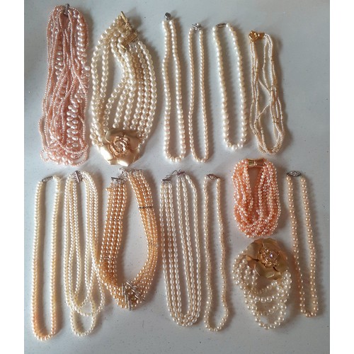 57 - A quantity of vintage costume jewellery to include simulated pearl necklaces to include a Chomel pin... 