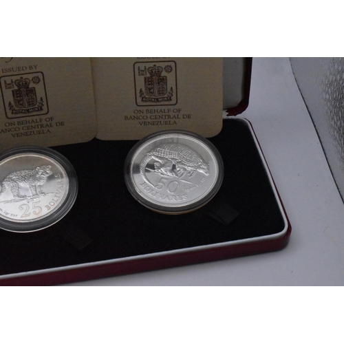 67 - Royal Mint - A pair of cased Two-Coin Silver commemoratives to include Venezuela 50 and 25 Bolivares... 