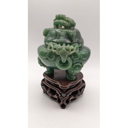 30A - A 20th century Chinese jade censor, the lid decorated with a coiled dragon and handles with dragon h... 