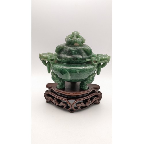 30A - A 20th century Chinese jade censor, the lid decorated with a coiled dragon and handles with dragon h... 