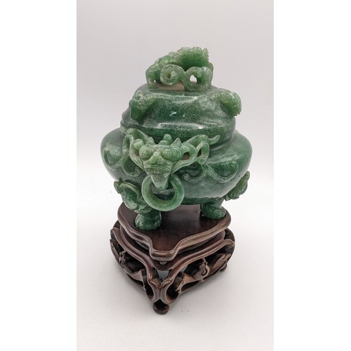 30A - A 20th century Chinese jade censor, the lid decorated with a coiled dragon and handles with dragon h... 