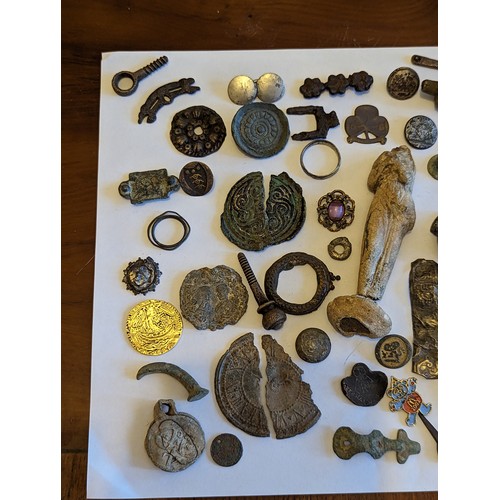 82 - Metal Detector Finds - A collection of mixed finds and artifacts to include brooches, silver rings a... 