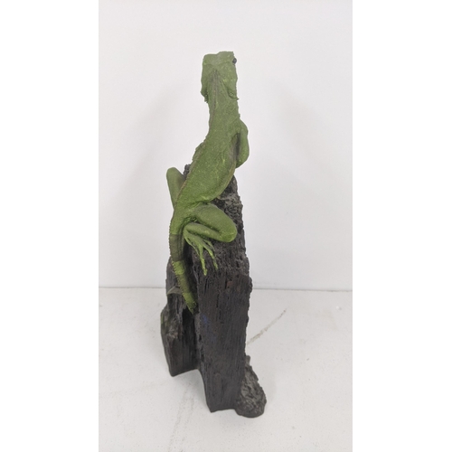 58 - A pottery sculpture of a naturalistic of a iguana on a rock signed Oswaldo Merchor 31.5cm high
Locat... 