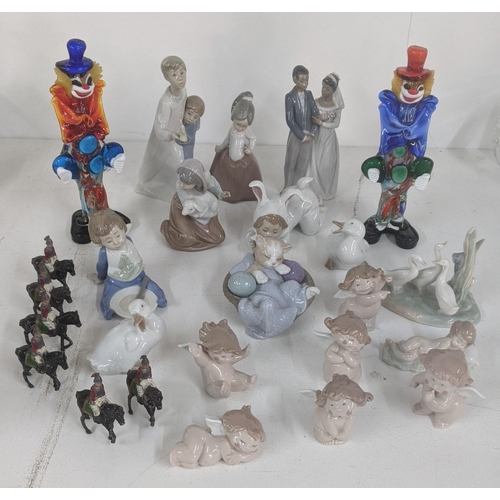 A collection of Lladro and Nao figurines to include six Nao cheeky cherubs, Lladro 4874 boy and girl together with two Murano glass clowns and six cast lead painted soldiers
Location: