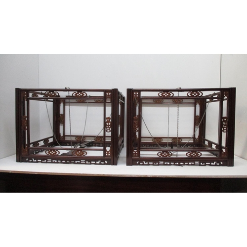 428 - A pair of 19th century Chinese tielimu and boxwood hanging lanterns, carved and fretworked with span... 