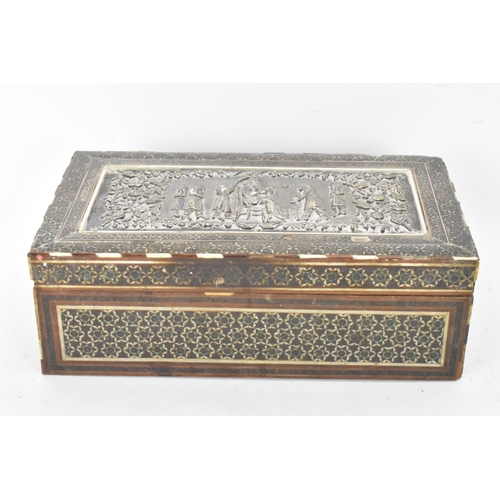 432 - A late 19th century Indo-Persian cigarette box, decorated with a silver repousse panel to the lid de... 