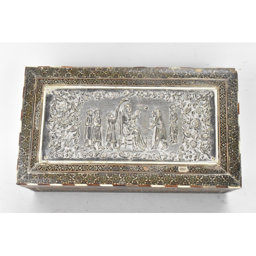 432 - A late 19th century Indo-Persian cigarette box, decorated with a silver repousse panel to the lid de... 