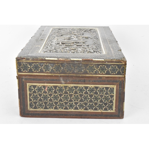 432 - A late 19th century Indo-Persian cigarette box, decorated with a silver repousse panel to the lid de... 