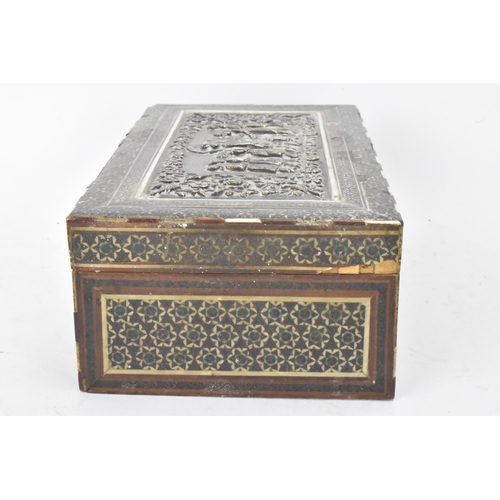 432 - A late 19th century Indo-Persian cigarette box, decorated with a silver repousse panel to the lid de... 