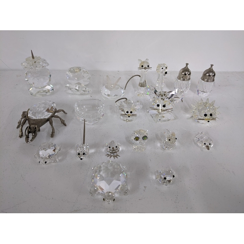 435 - A mixed lot of miniature crystal figurines, some marked Swarovski to include a beetle, owl, salt and... 