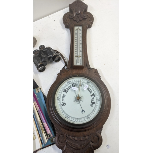 437 - A mixed lot to include an early 20th century wall hanging barometer, a Cornish carved stoneware marb... 