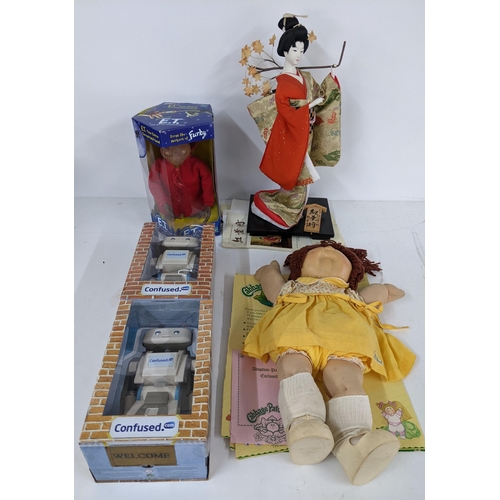 439 - A mixed lot of figurines to include an interactive E.T, a Cabbage Patch Kid with adoption paperwork,... 