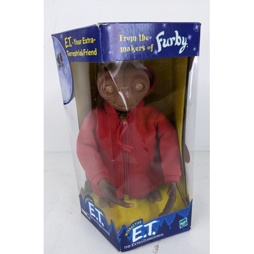 439 - A mixed lot of figurines to include an interactive E.T, a Cabbage Patch Kid with adoption paperwork,... 