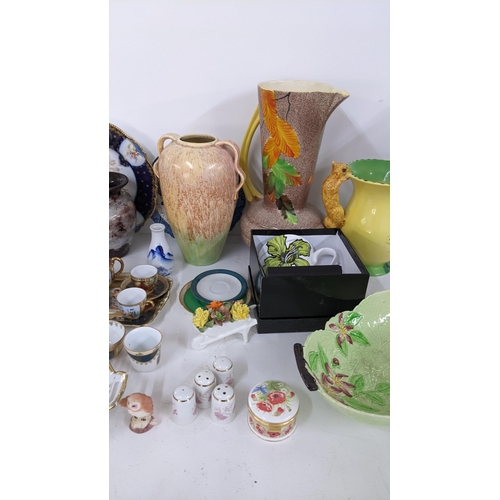 445 - A mixed lot to include a Royal Crown Derby pin dish, Wilkinsons lustre vase, Carlton ware, Vienna mi... 