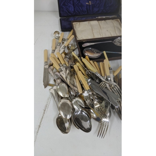 446 - A mixed lot to include cutlery, Selkirk glass paperweight, silver plated tea pot and other items
Loc... 