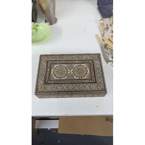 447 - A Middle Eastern parquetry inlaid box, with repeating motifs within boarders
Location:RAB

If there ... 