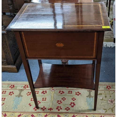 66 - An Edwardian mahogany and boxwood inlaid sewing table having a hinged top with shelf below, 78.5cm h... 