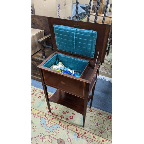 66 - An Edwardian mahogany and boxwood inlaid sewing table having a hinged top with shelf below, 78.5cm h... 