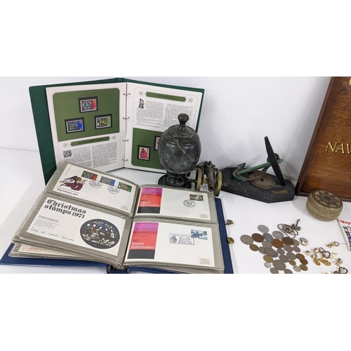 75 - A mixed lot to include a naval plaque, naval related badges and cufflinks, brass model of a canon fi... 