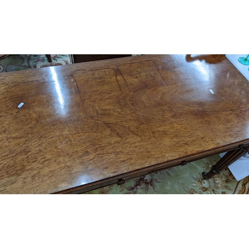 86 - A late Victorian Warring & Gillows style side table having two short drawers and reeded tapering leg... 