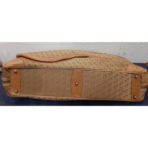 22 - Gucci-A 1960's brown canvas and leather tennis bag A/F in a rare Gucci logo having a luggage label, ... 