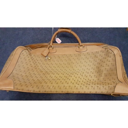 22 - Gucci-A 1960's brown canvas and leather tennis bag A/F in a rare Gucci logo having a luggage label, ... 