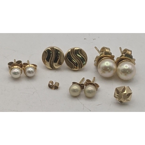 62 - Three pairs of gold earrings all tested as 9ct to include a pair of circle shaped ware design stud e... 