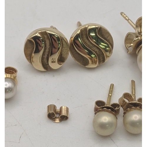 62 - Three pairs of gold earrings all tested as 9ct to include a pair of circle shaped ware design stud e... 