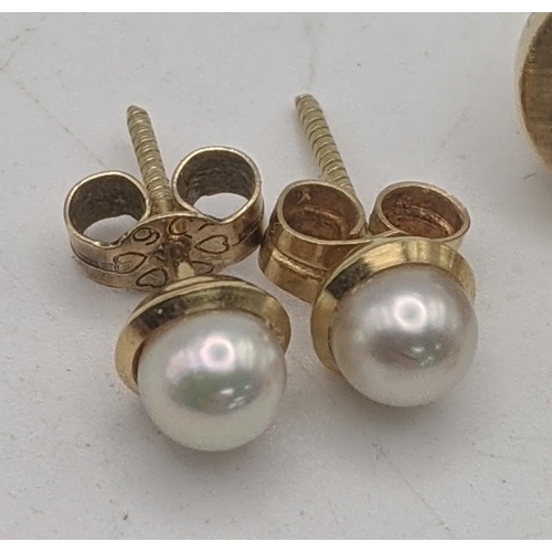 62 - Three pairs of gold earrings all tested as 9ct to include a pair of circle shaped ware design stud e... 