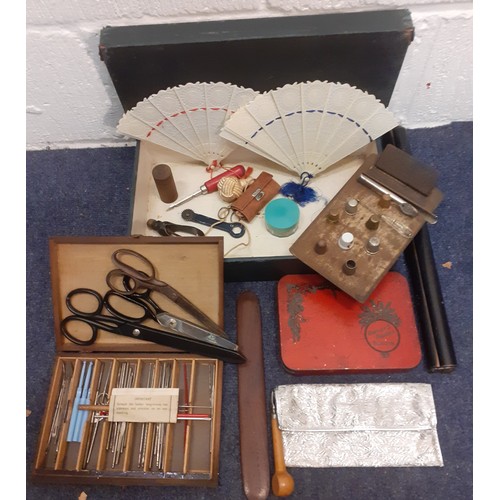 153 - A 1920's haberdashery box of miscellaneous haberdashery accessories and decorative items to include ... 