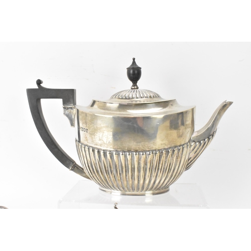 1 - A Victorian silver matched three piece tea set, comprising a teapot hallmarked London 1897, a Mappin... 