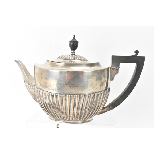 1 - A Victorian silver matched three piece tea set, comprising a teapot hallmarked London 1897, a Mappin... 