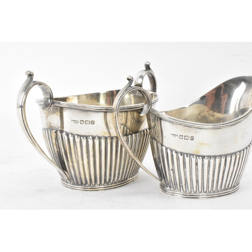 1 - A Victorian silver matched three piece tea set, comprising a teapot hallmarked London 1897, a Mappin... 