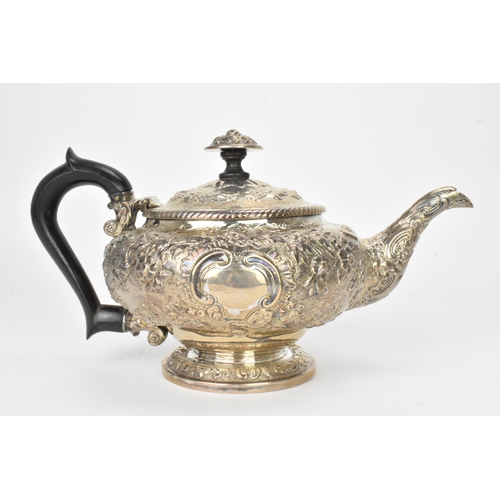 10 - A George III silver teapot, by Rebecca Emes & Edward Barnard I, hallmarked London 1819, having an eb... 