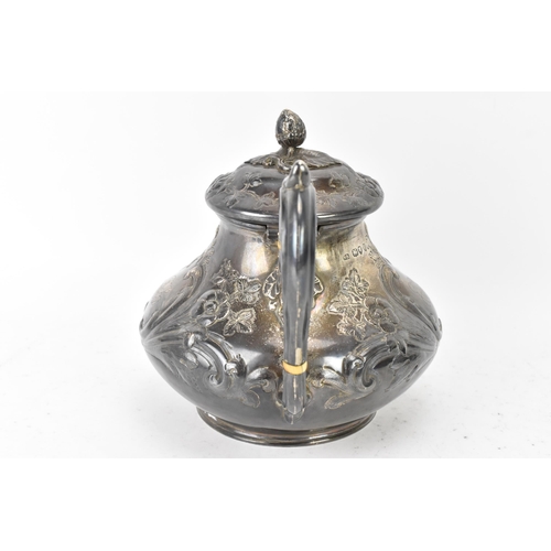 100 - A Victorian silver teapot by Goldsmiths Alliance Ltd, hallmarked London 1878, having an acorn finial... 