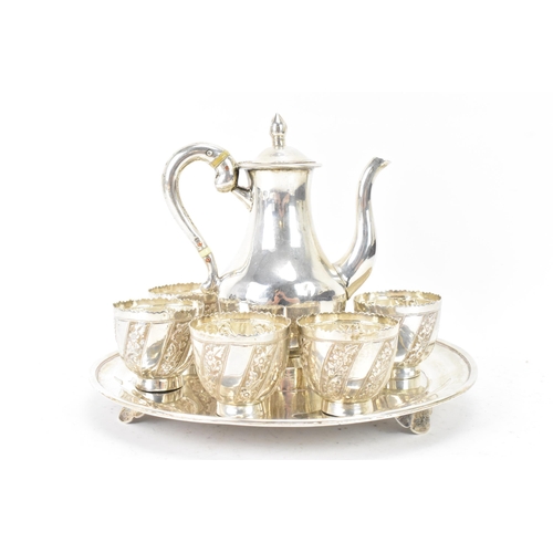 105 - A late 19th/early 20th century Asian silver tea set comprising of a teapot, six tea bowls and a matc... 