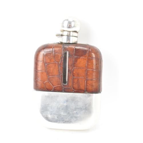 107 - A George V silver hip flask by Ollivant & Botsford, hallmarked London 1927, having a crocodile leath... 