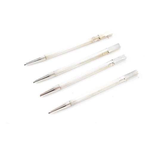 109 - A mid 20th century set of Four cased Sterling Silver ‘ Bridge ‘ Propelling Pencils, each with a squa... 