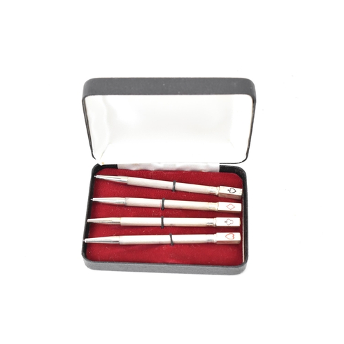 109 - A mid 20th century set of Four cased Sterling Silver ‘ Bridge ‘ Propelling Pencils, each with a squa... 