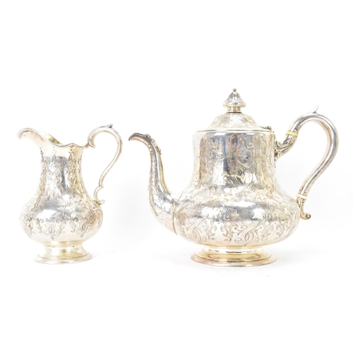 112 - A Victorian silver teapot and matching cream jug by Robert Hennell III, hallmarked London 1855, each... 