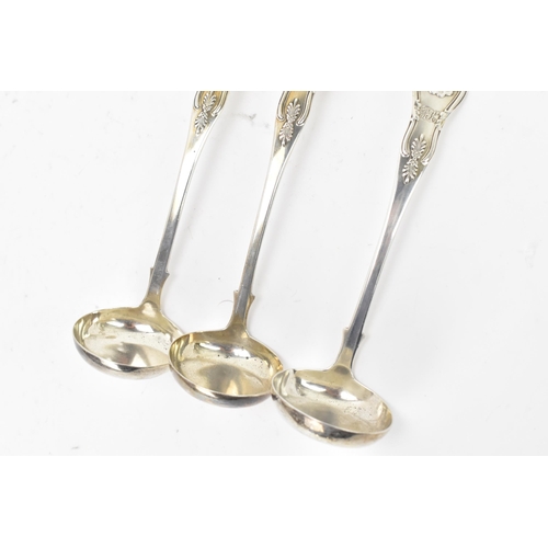 115 - A Victorian silver set of three silver sauce ladles by Robert Livingstone Christie, hallmarks for Ed... 