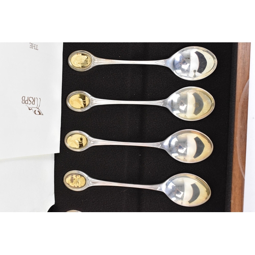 123 - An Elizabeth II silver cased set of The Royal Society For The Protection Of Birds Spoon Collection, ... 