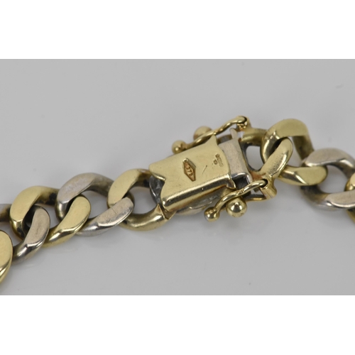 124 - A 9ct gold bi-coloured curb link bracelet, hallmarked 375 to the clasp, 20.5cm, 21.9 grams