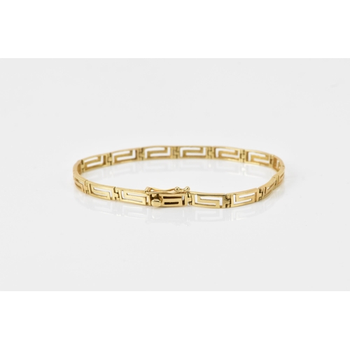 126 - A 14ct gold bracelet having Grecian key design links, stamped 585 to the clasp, 18cm, 6.4 grams