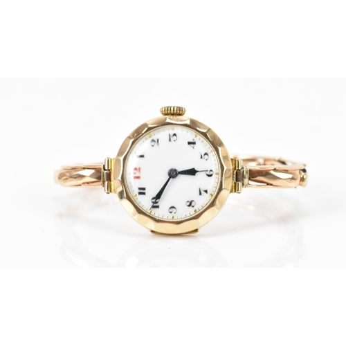 130 - An early 20th century 9ct yellow gold ladies manual wind wristwatch, on a 9ct gold expanding bracele... 