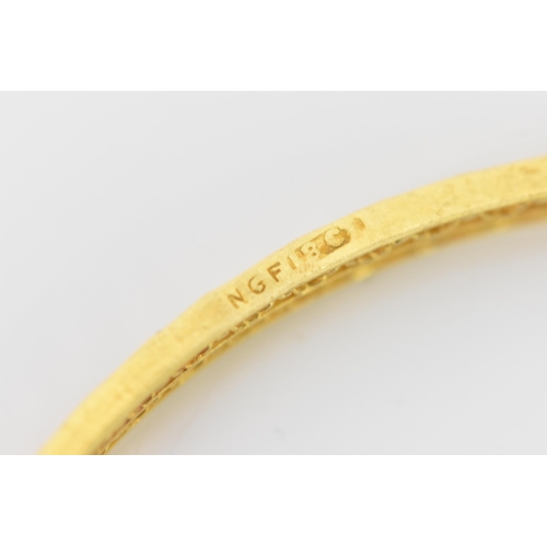 134 - An 18ct yellow gold bangle, having a pierced woven design and stamped N G F 18ct to the border, 7cm ... 