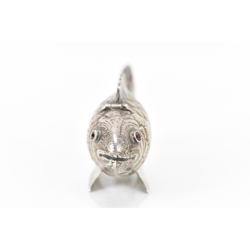 136 - A late Victorian silver novelty lady's sewing etui, fashioned as an articulated fish, the hinged hea... 