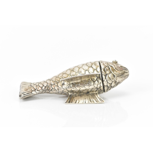 136 - A late Victorian silver novelty lady's sewing etui, fashioned as an articulated fish, the hinged hea... 