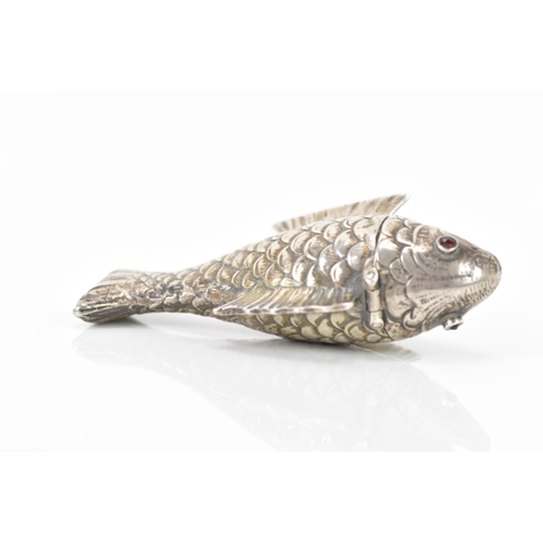 136 - A late Victorian silver novelty lady's sewing etui, fashioned as an articulated fish, the hinged hea... 