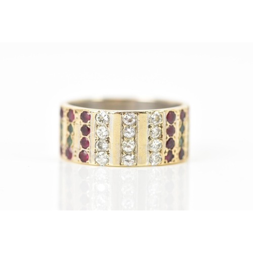 138 - A 9ct yellow and white gold ring, inset with rows of eight emeralds, sixteen rubies and twelve diamo... 